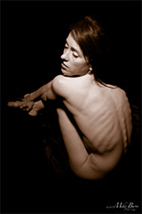 art nude - thin woman curled up