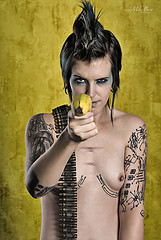 misc - girl with blue mohawk holding banana gun